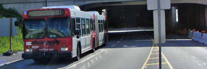 OC Transpo New Flyer D60LF articulated bus 6091 leaving busway tunnel